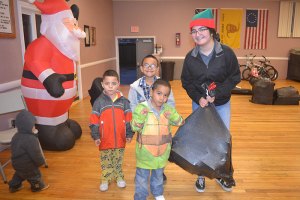 This family got early Christmas presents at the annual "Reasons for the Season" annual gathering at the Lemoore Veterans' Hall on Friday night, Dec. 15.
